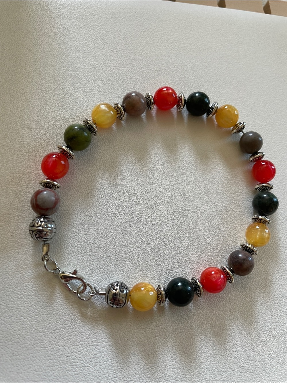 8.5” Autumn color multi-stone bracelet with stainless steel accents